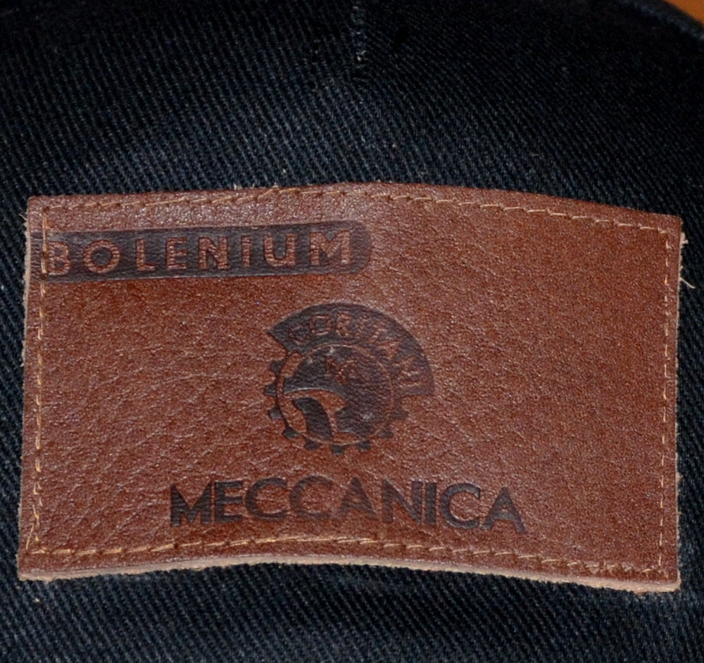 leather badge on black cotton cap